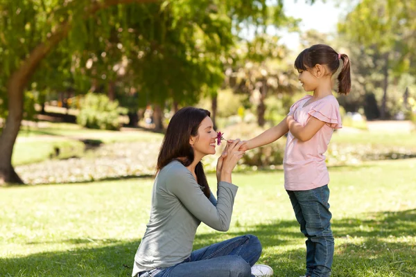 Joyful mother with her daughter in the park — Stock Photo, Image