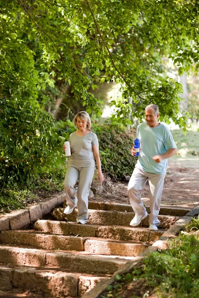 Couple running in the wood — Stock Photo, Image