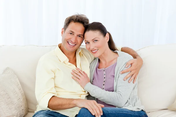 Portrait of a lovely couple on the sofa — Stock Photo, Image