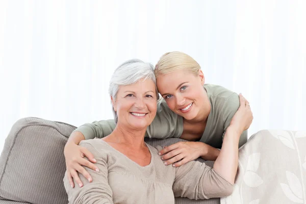 Wonderful nurse and her mature patient looking at the camera Stock Image