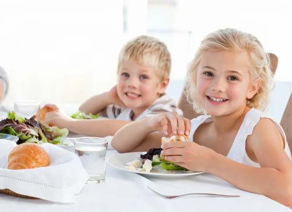 Happy children at the table Royalty Free Stock Images