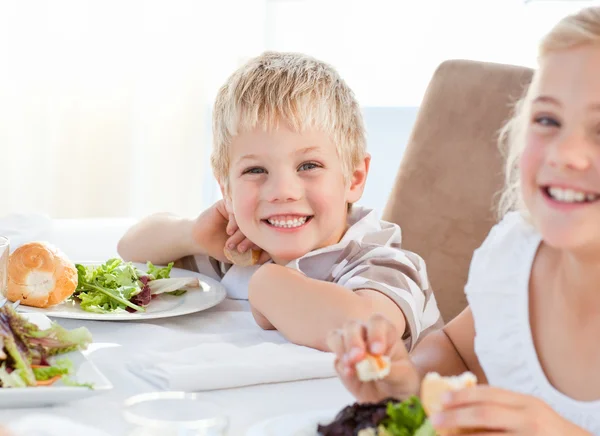 Happy children at the table Royalty Free Stock Images