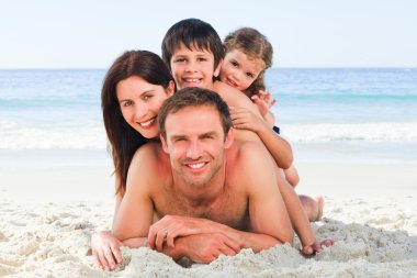 Family on the beach clipart