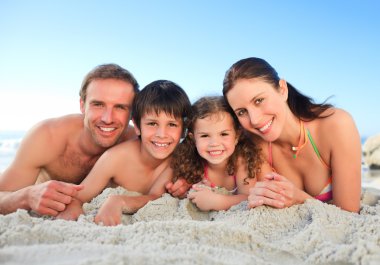 Family at the beach clipart