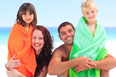 Parents with their children in towels clipart