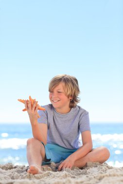 Little boy with a starfish clipart