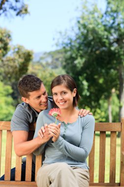 Man and his wife with a flower clipart