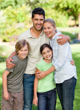 Happy family in the park clipart