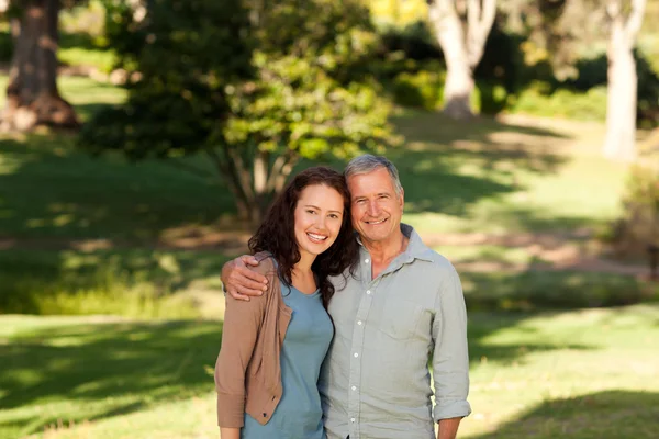 Woman with her father-in-law in the park — Stock Photo, Image