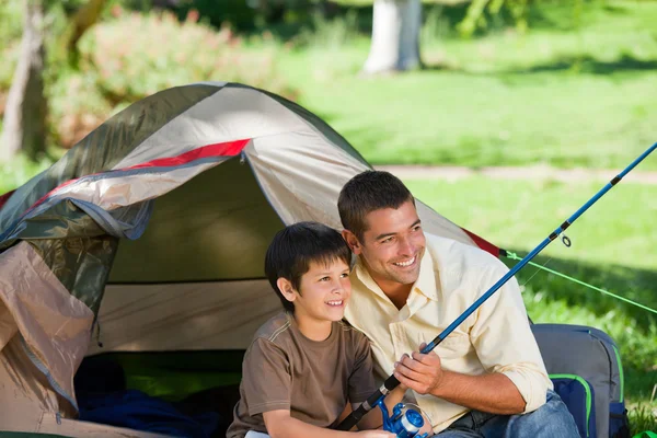 Son fishing with his father — Stock Photo, Image