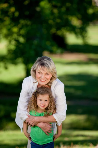 Grandmother and her granddaughter looking at the camera — Stock Photo, Image