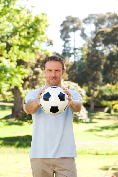 Handsome man with a ball — Stock Photo, Image