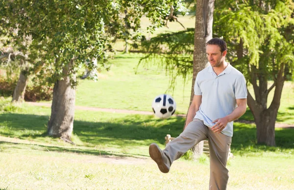 Handsome man with a ball — Stock Photo, Image