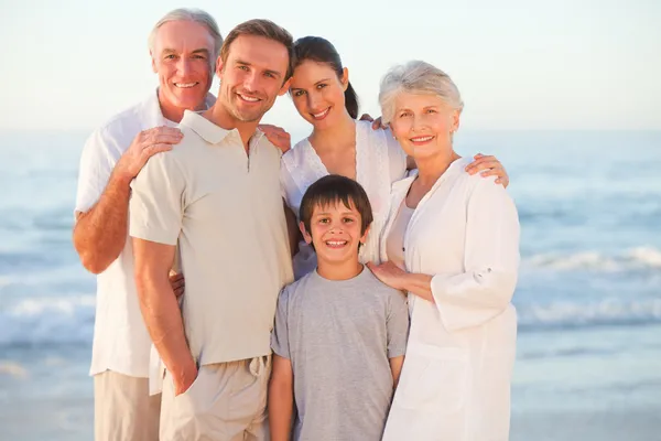 Portrait of a smiling family at the beach — Stock Photo, Image