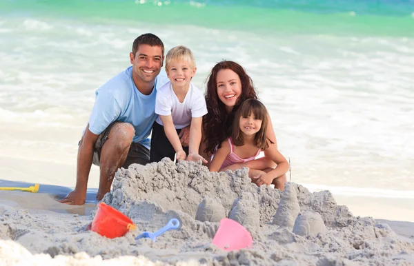 Radiant family at the beach — Stock Photo, Image