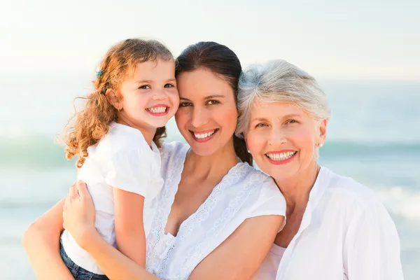 Lovely family at the beach — Stock Photo, Image