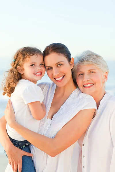 Lovely family at the beach — Stock Photo, Image