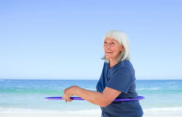 Senior woman playing with her hoop — Stock Photo, Image