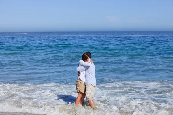 Lovely couple in the sea — Stock Photo, Image