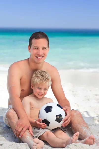 Son playing football with his father — Stock Photo, Image