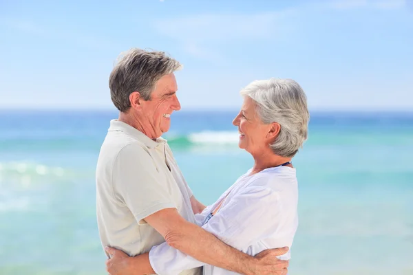 Elderly man embracing her wife — Stock Photo, Image