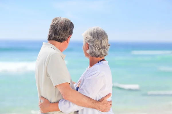 Elderly man embracing her wife — Stock Photo, Image