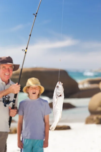 Man fishing with his grandson — Stock Photo, Image