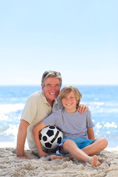 Grandfather and his grandson with a ball — Stock Photo, Image