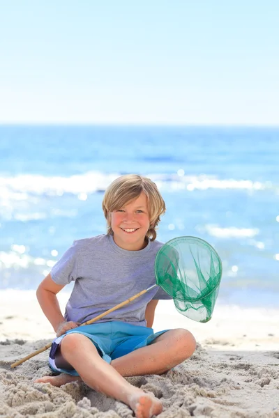 男孩与他的渔网 — 图库照片