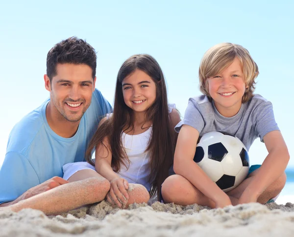 Father and his children with a ball — Stock Photo, Image