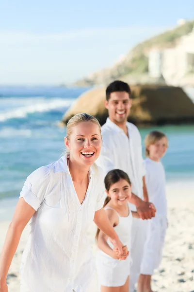 Portrait of a cute family at the beach — Stock Photo, Image