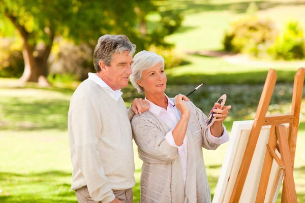 Pintura de casal aposentado no parque — Fotografia de Stock