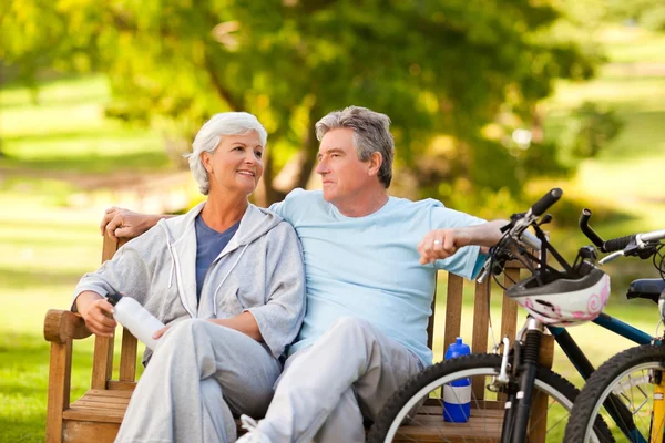 Elderly couple with their bikes — Stock Photo, Image