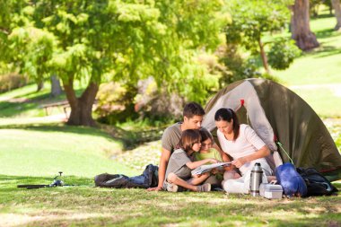 Family camping in the park clipart