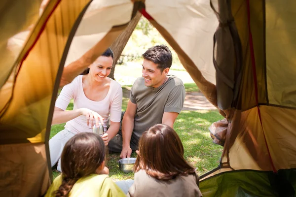 Happy family camping in the park — Stock Photo, Image