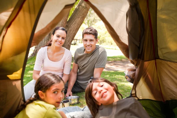 Happy family camping in the park — Stock Photo, Image