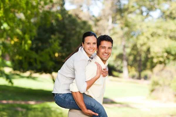 Man giving wife a piggyback Stock Photo