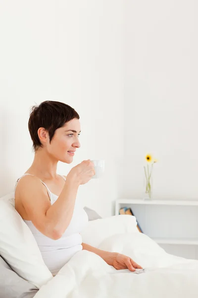 Good looking woman drinking coffee — Stock Photo, Image