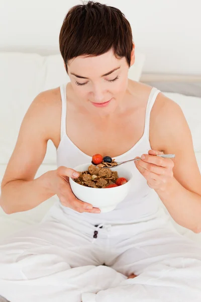 Lovely woman eating her cereal — Stock Photo, Image