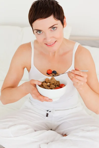 Lovely woman eating breakfast — Stock Photo, Image