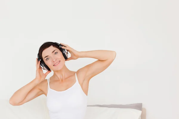 Lovely woman listening to music — Stock Photo, Image