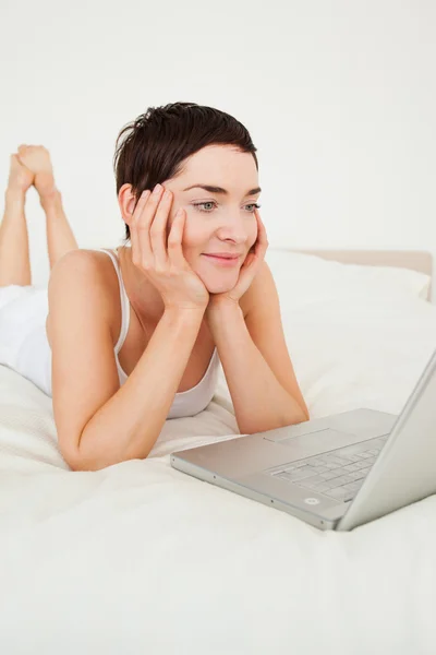Good looking woman using a laptop — Stock Photo, Image