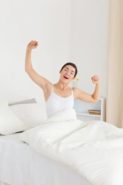 Portrait of a woman stretching her arms — Stock Photo, Image