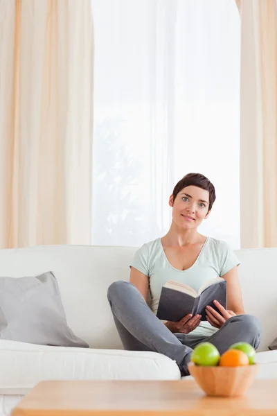 Lovely woman holding a book — Stock Photo, Image