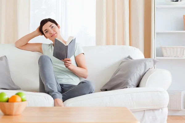 Cute brunette reading a book — Stock Photo, Image