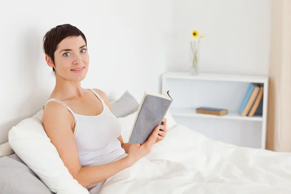 Young woman holding a book — Stock Photo, Image