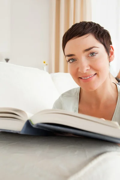 Portrait of a short-haired woman with a book — Stock Photo, Image