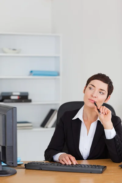 Portrait of a secretary thinking — Stock Photo, Image
