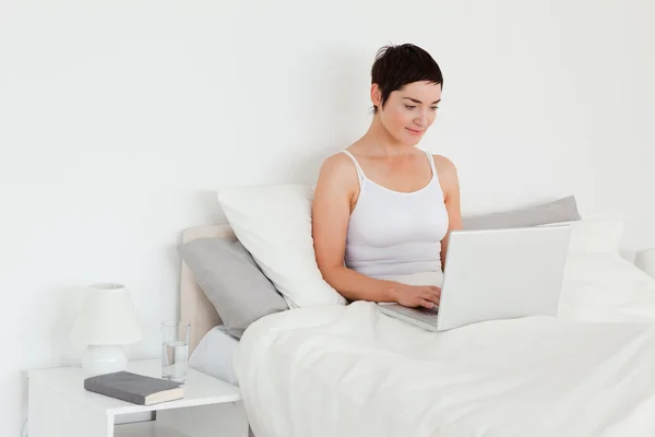 Beautiful woman using a laptop — Stock Photo, Image