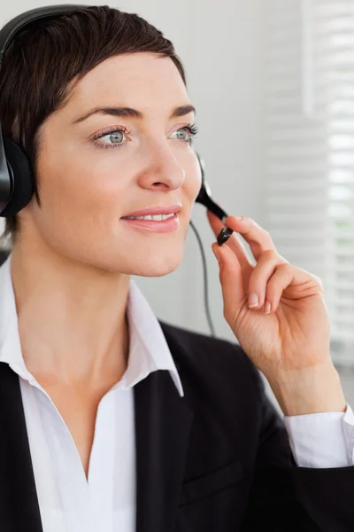 Portrait of a serious secretary with a headset — Stock Photo, Image